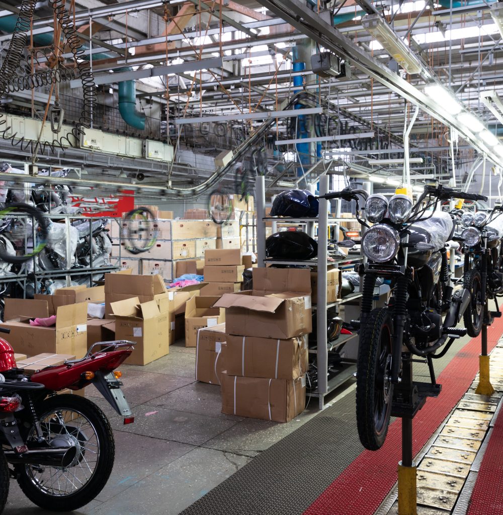 assembly line in a motorcycle factory, manual labor.